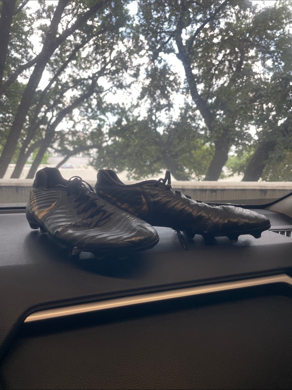 Nike Men's Black Soccer Cleats with Subtle Gold Swoosh